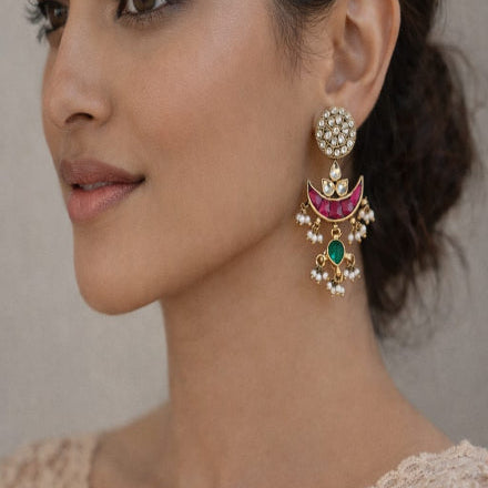 Close-up of a woman wearing ornate earrings
