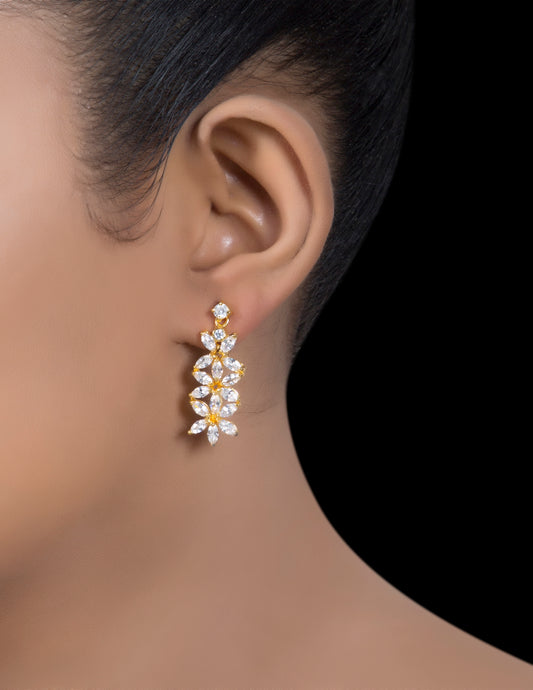 Gold tone silver zirconia leaf drop earrings