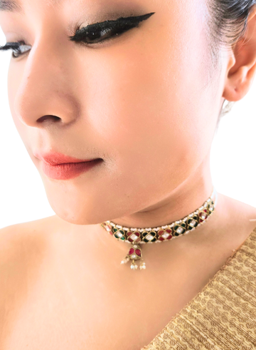 Close-up of a woman wearing a decorative choker necklace.