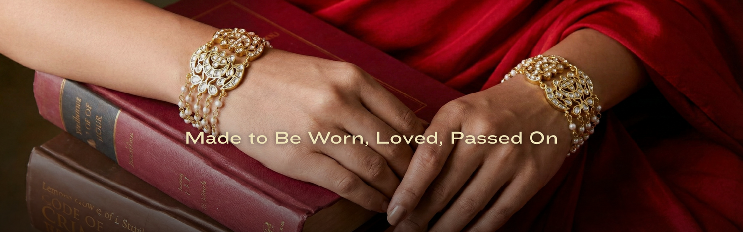 Close-up of hands wearing gold bracelets 