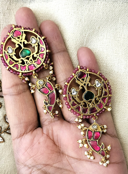women holding pink reaings in hand