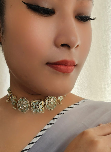 Close-up of a woman wearing a decorative necklace 