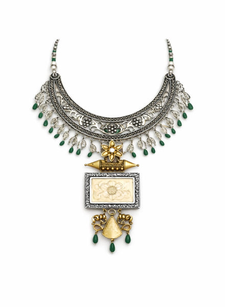 Ornate necklace with green beads and gold accents 
