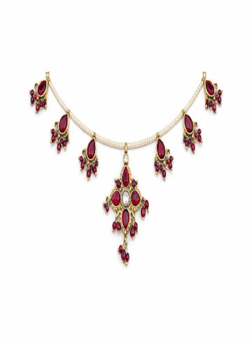 Jewelry set with red gemstones and gold accents 