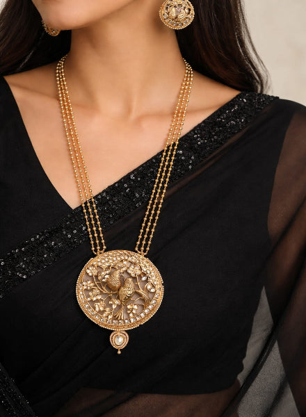 Gold bird pendant set