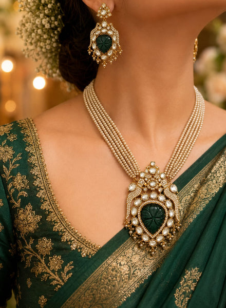 Carved jade and pearl bird necklace