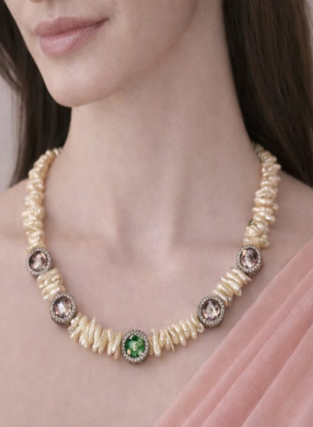 Pearl necklace with gemstones worn by a model